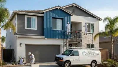 Professional house painters working on residential exterior in Fresno, CA